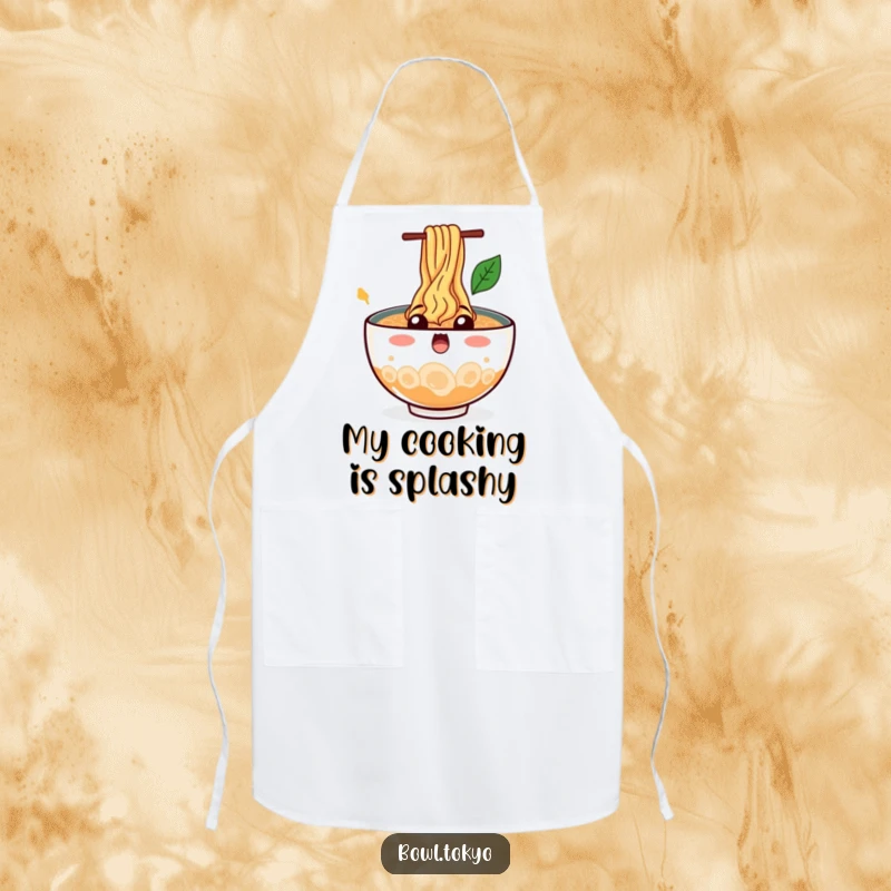 Funny Kitchen Ramen Bowl Apron depicting a surprised character with noodles splashing out, making cooking a fun and messy affair.