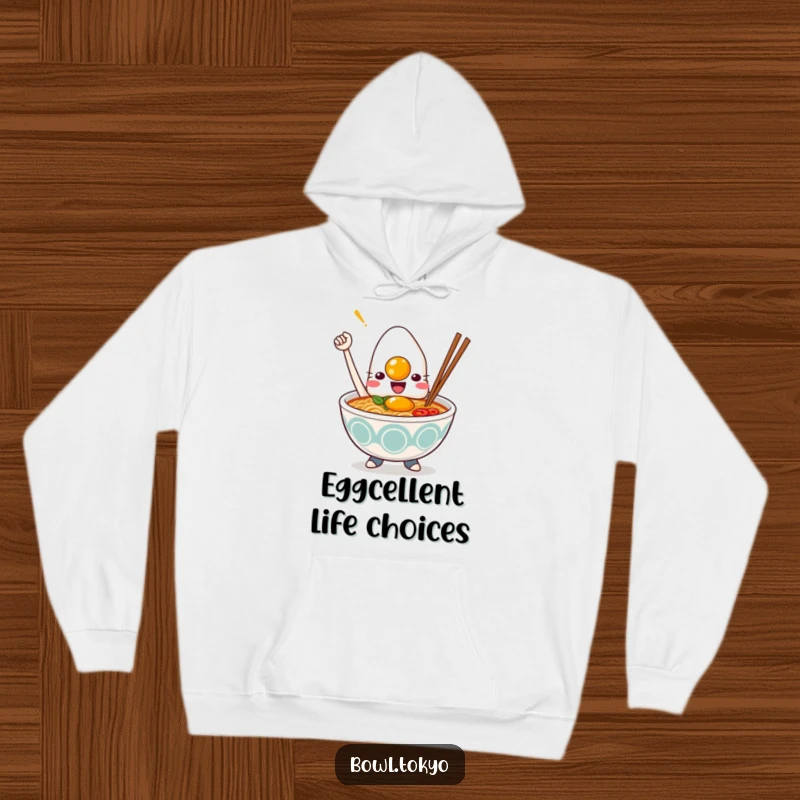 Funny Kawaii ramen bowl hoodie, character proudly holding a perfectly cooked egg, steaming bowl, cozy and hilarious, giftable.