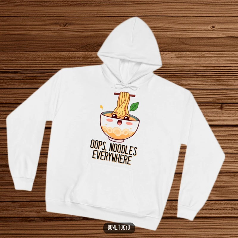 Funny Cozy Ramen Bowl Hoodie featuring a surprised character with noodles splashing out, bringing humor and warmth.