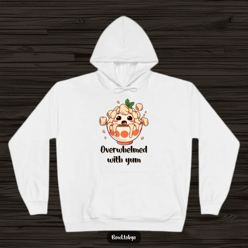 Funny hoodie depicting a surprised ramen bowl character covered in falling dumplings, cozy and amusing for casual wear.