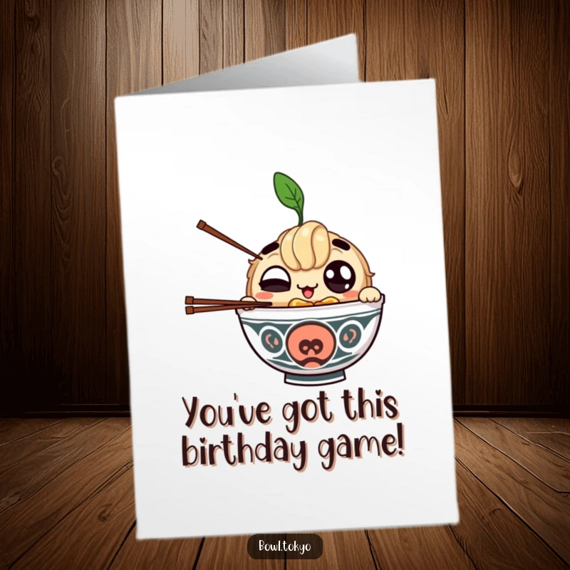 Funny Free Printable Birthday Card: Big-eyed ramen bowl character humorously juggling chopsticks for a birthday wish.