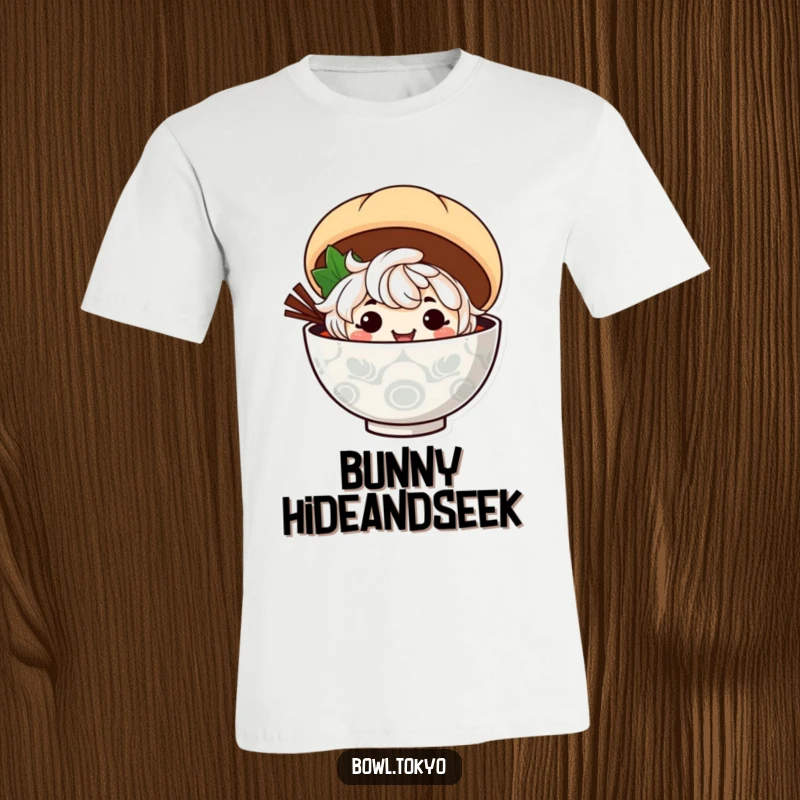 Funny ramen bowl character with a wide mischievous grin peeks around a large steamed bun on this t-shirt.